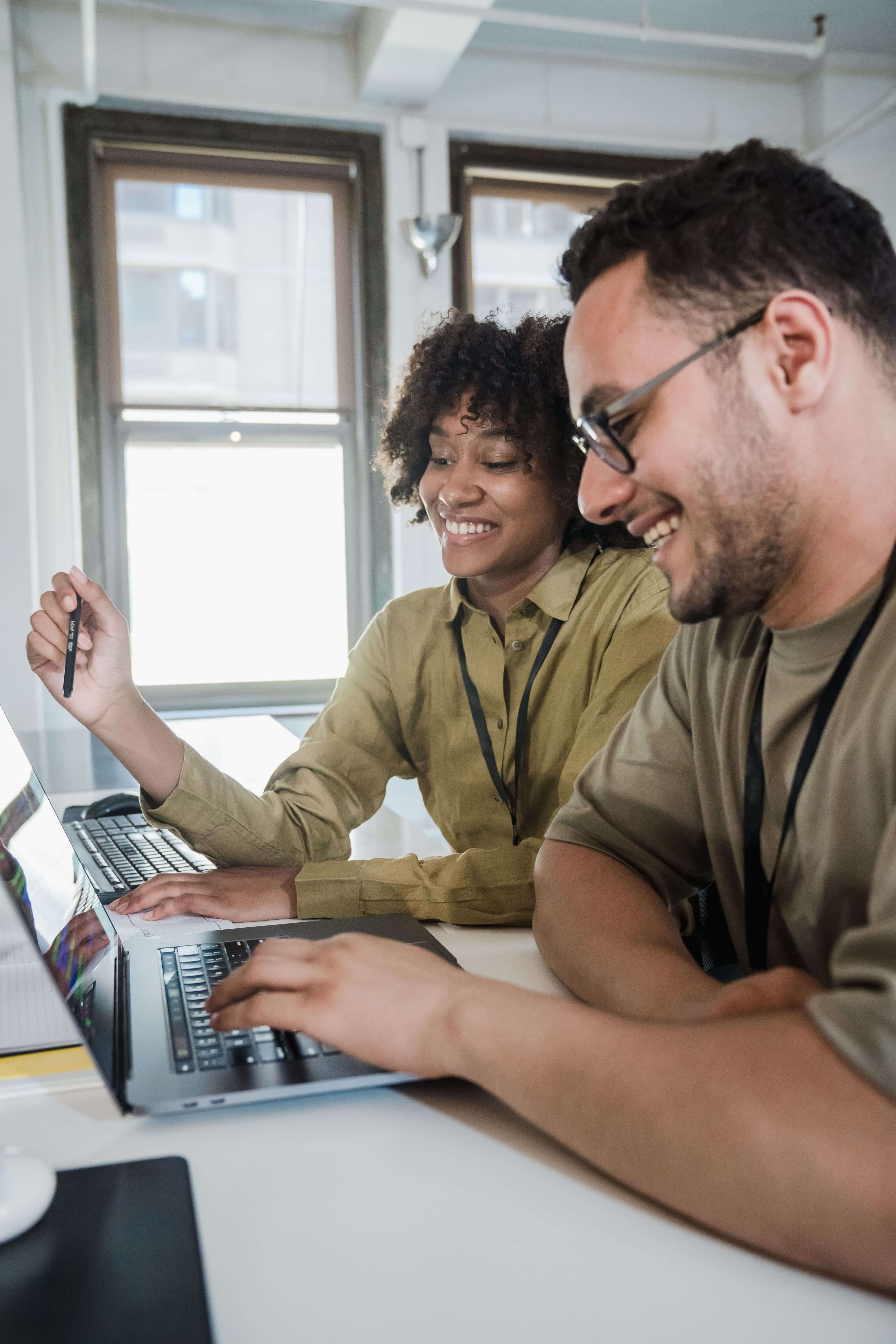 Business partners proudly admiring the software application they built in the Carrot platform